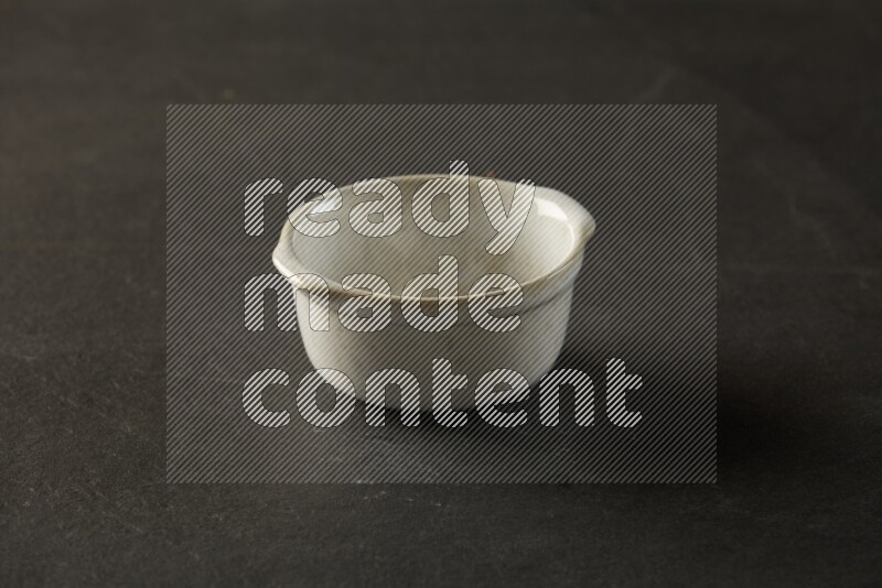 multi color round bowl on grey textured countertop