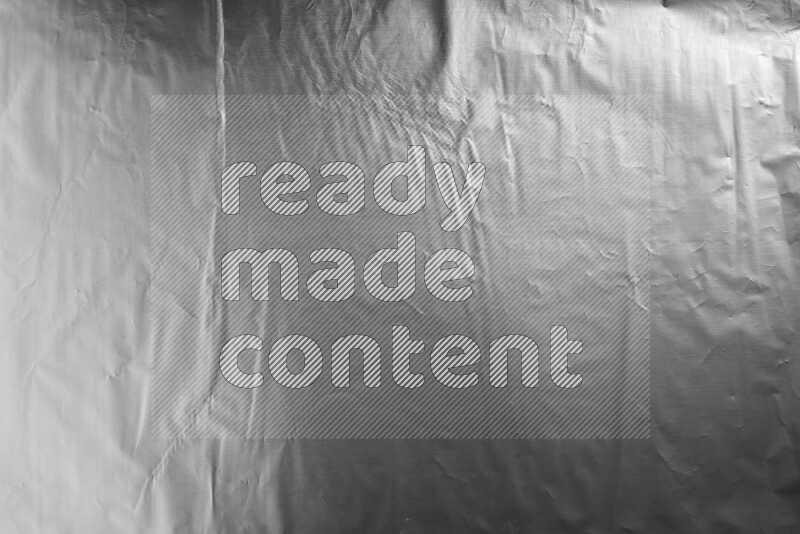 Aluminium foil on black background