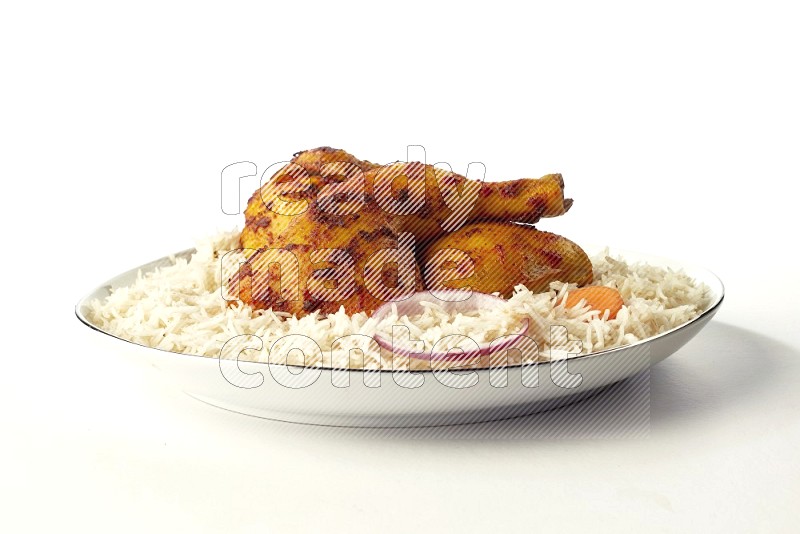 white basmati Rice with kabsa chicken pieces on a white plate with a silver rim direct on white background