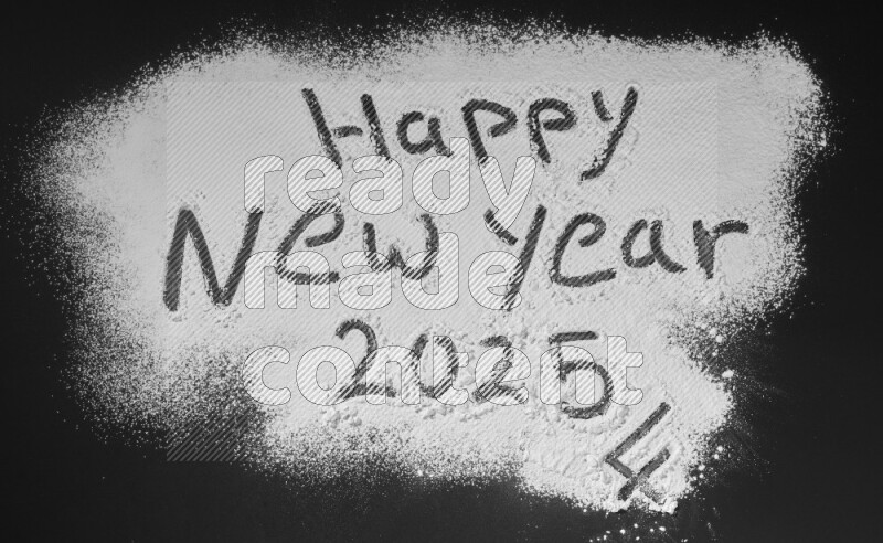 A sentence written with powder on black background