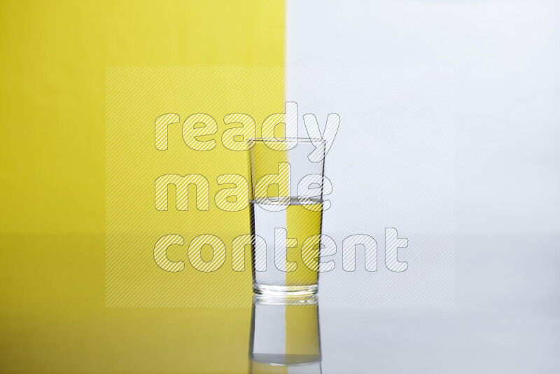 The image features a clear glassware filled with water, set against white and yellow background