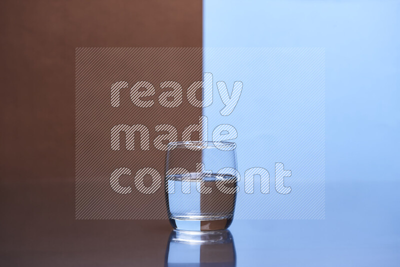 The image features a clear glassware filled with water, set against brown and light blue background