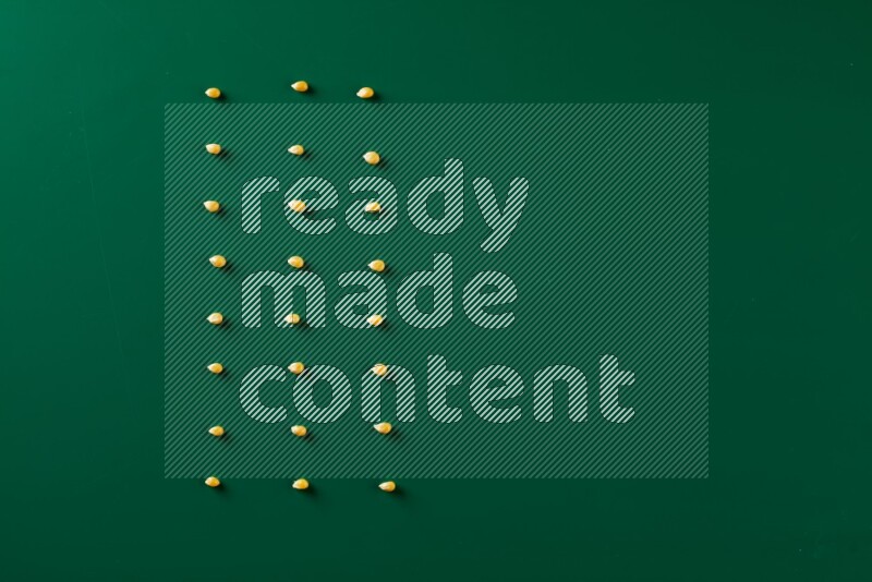 Popcorn seeds on a green background in a top view shot