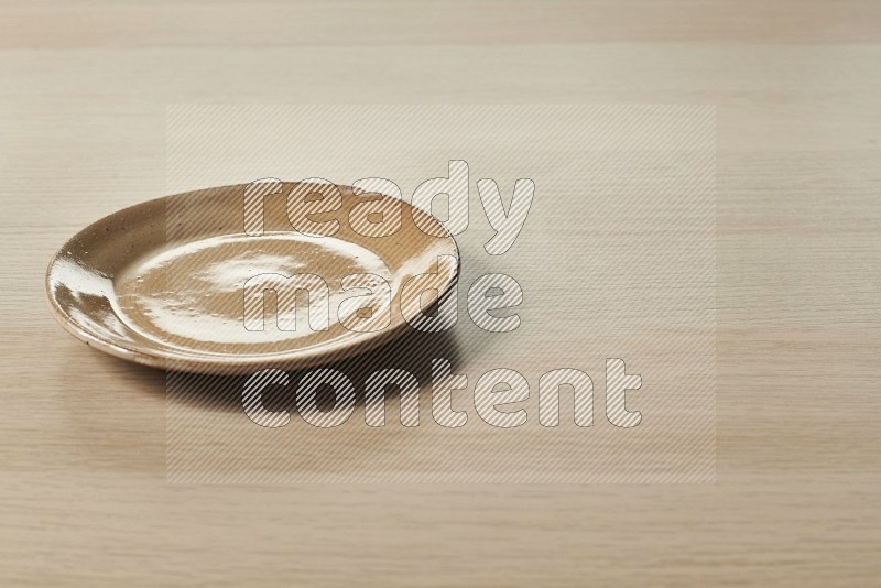Beige Pottery Plate on Oak Wooden Flooring, 15 degrees