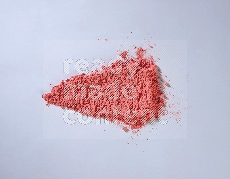 Red powder strokes on white background