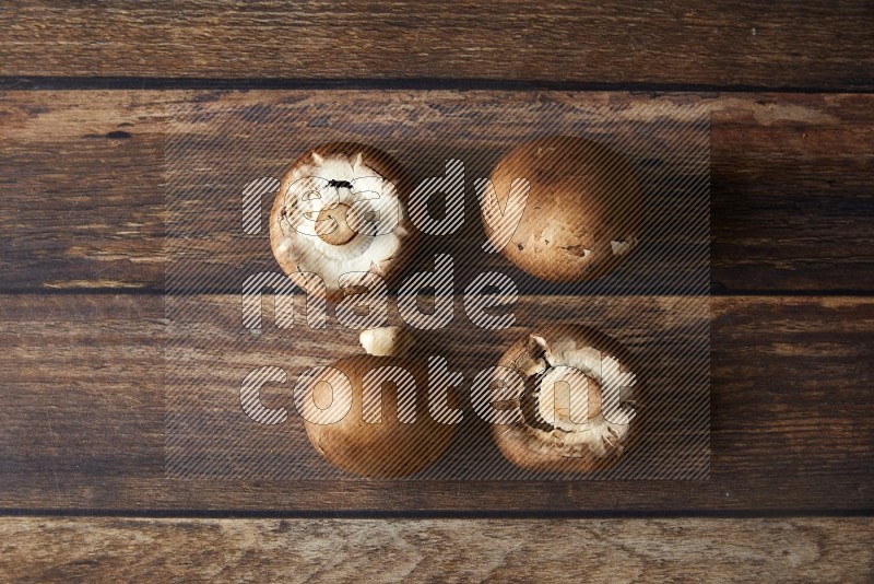 small fresh Cremini mushrooms topview  on wooden  background
