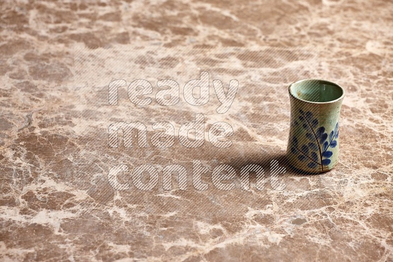 Pottery Cup on Beige Marble Flooring