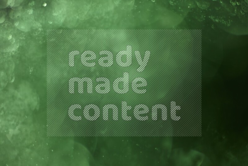 Green glitter powder isolated on black background