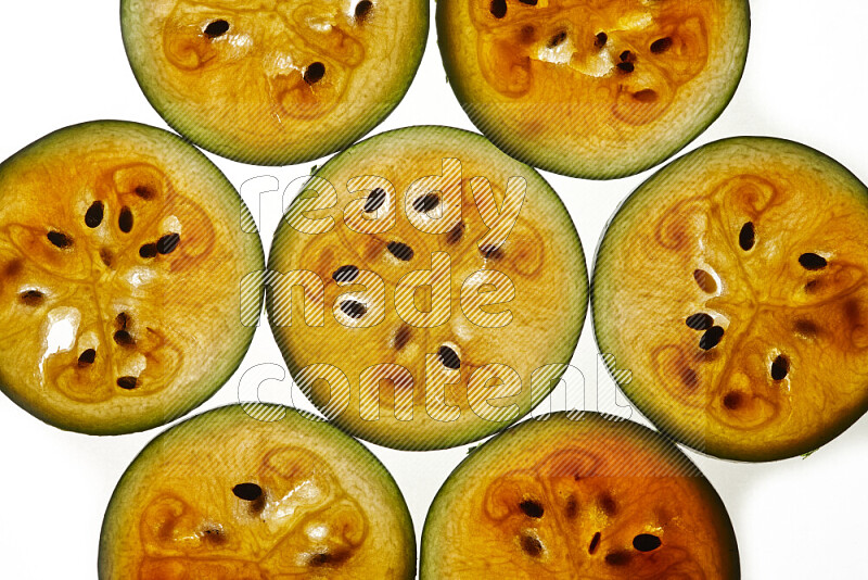 Watermelon slices on illuminated white background