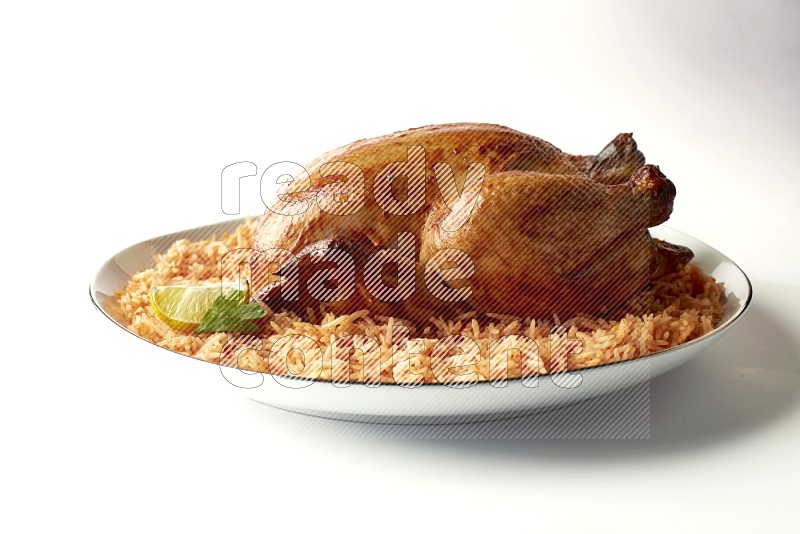 red basmati Rice with whole roasted chicken on a white plate with a silver rim direct on white background