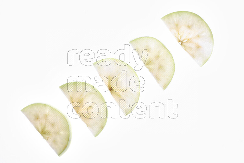 Apple slices on illuminated white background