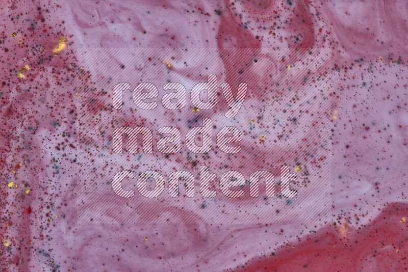 لقطة مقربة لأنماط دوامية باللون الأحمر مع جزئيات ملونة