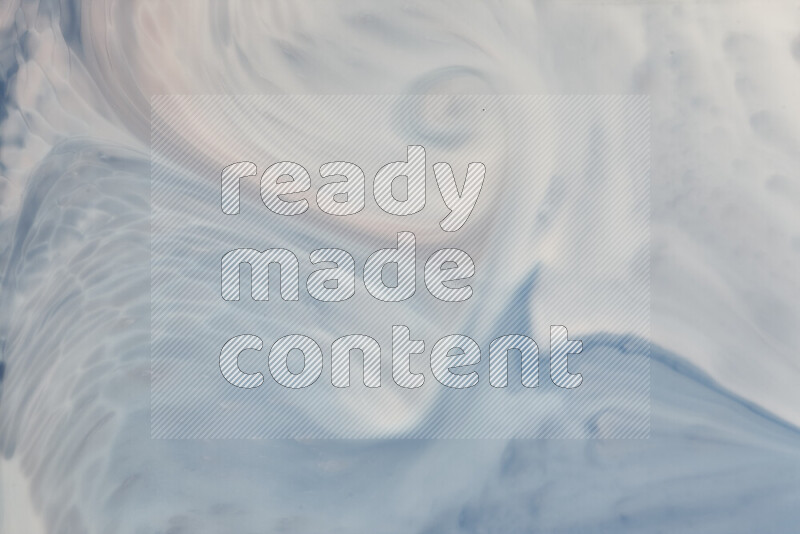 لقطة مقربة لأنماط دوامية باللون الأزرق والأبيض