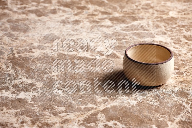 Beige Pottery Oven Bowl on Beige Marble Flooring, 45 degrees