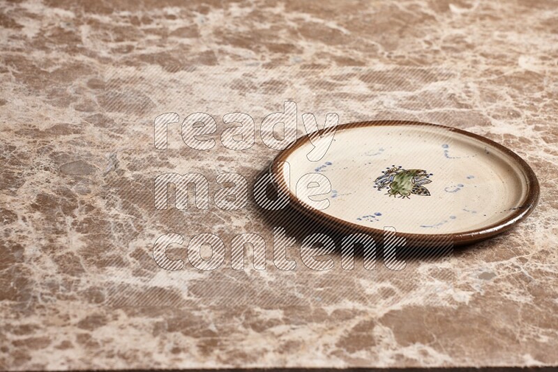 Decorative Pottery Plate on Beige Marble Flooring