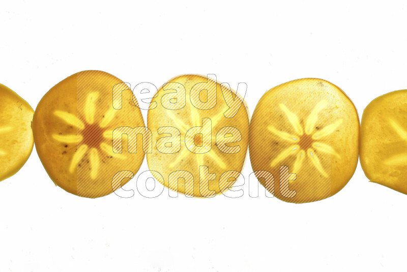 Persimmon slices on illuminated white background