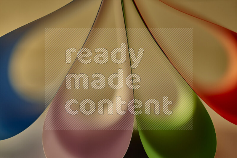 An abstract art piece displaying smooth curves in colorful gradients created by colored light