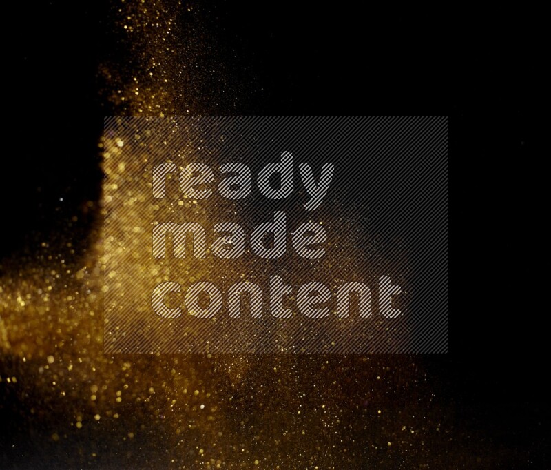 Gold glitter powder isolated on black background
