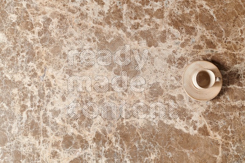 Top View Shot Of A Pottery Cup On beige Marble Flooring