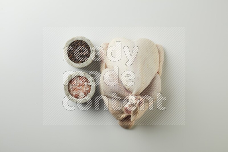 Whole fresh chicken direct on a white background