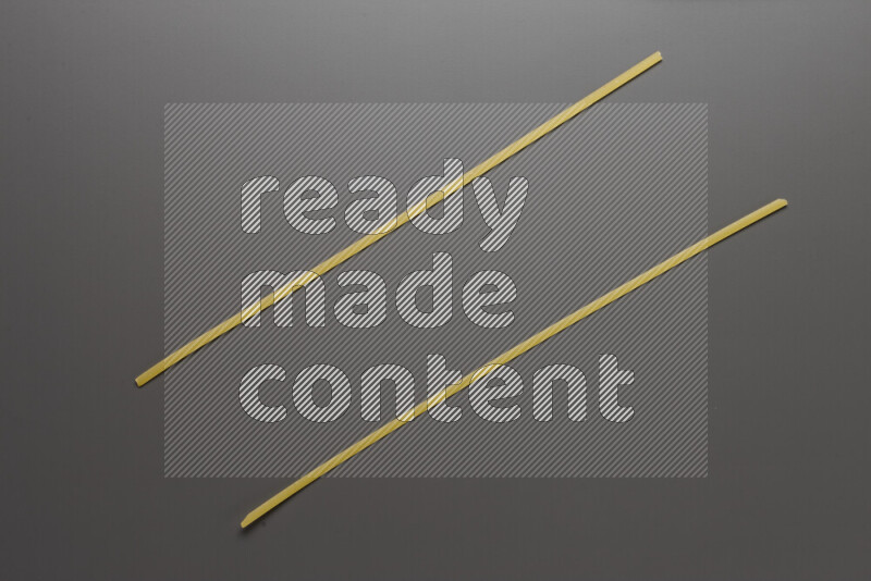 Linguini pasta on grey background