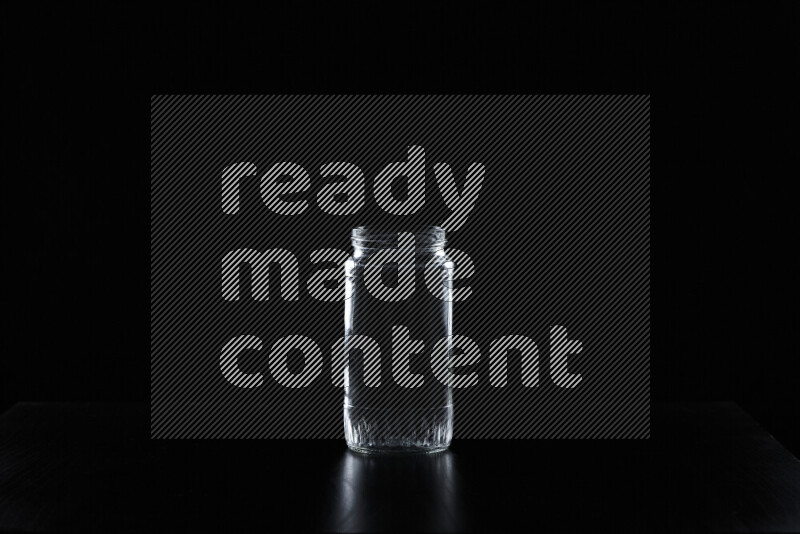 Glassware with rim light against black background