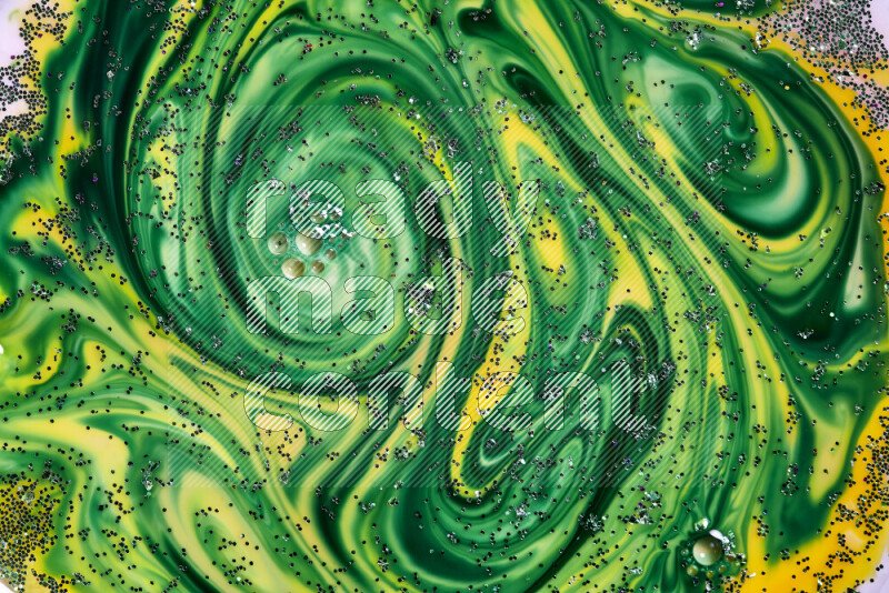 لقطة مقربة لبريق أخضر متلألئ منتشر على خلفية من اللون الأصفر والأخضر في حركات دائرية