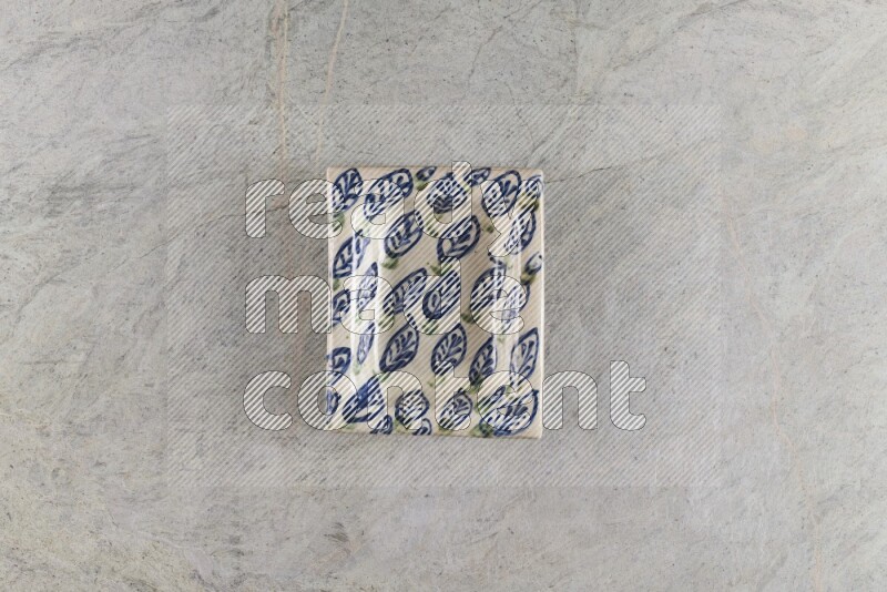 A decorative pottery plate on grey marble background