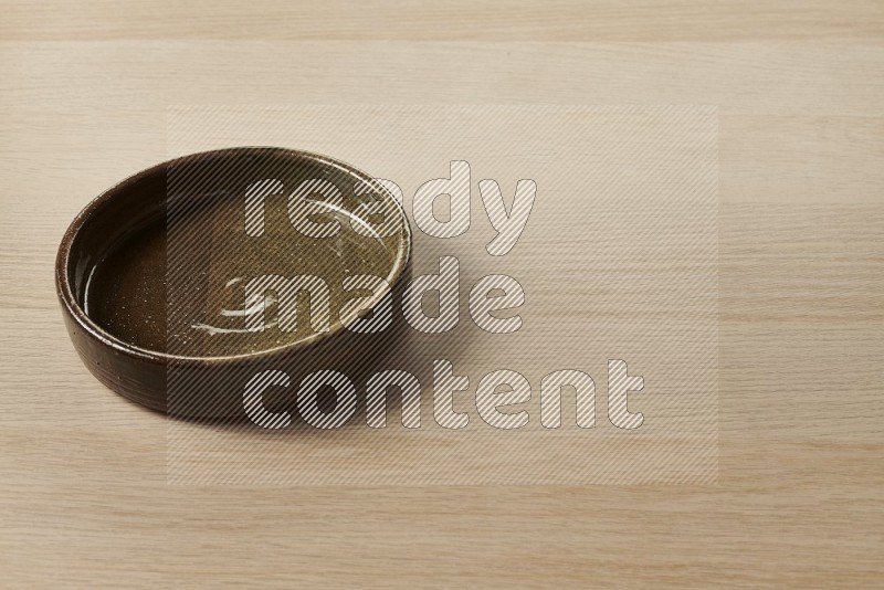 Multicolored Pottery Oven Plate on Oak Wooden Flooring, 45 degrees