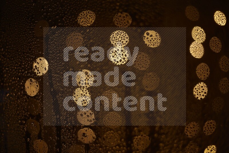 Bokeh light in yellow with water drops