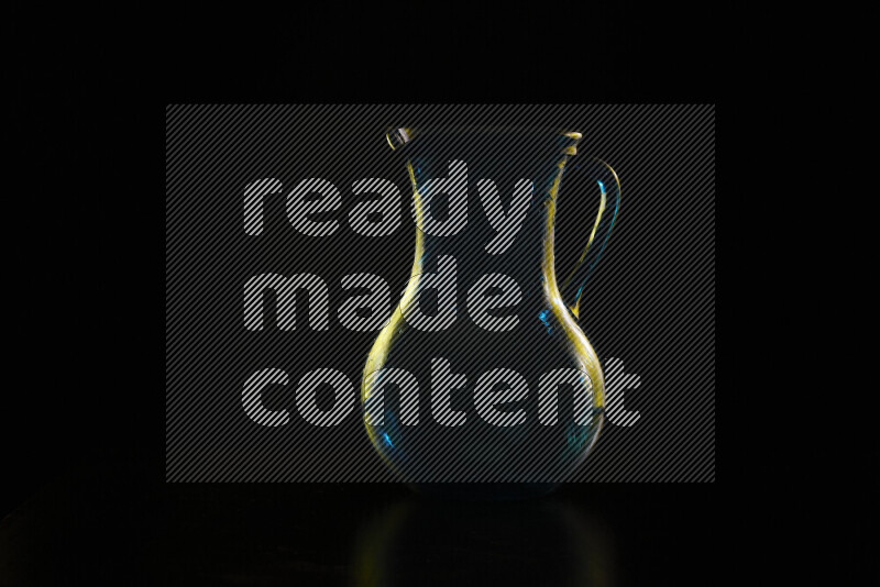 Glassware with rim light in yellow against black background