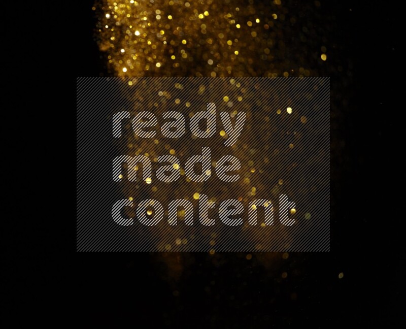 Gold glitter powder isolated on black background