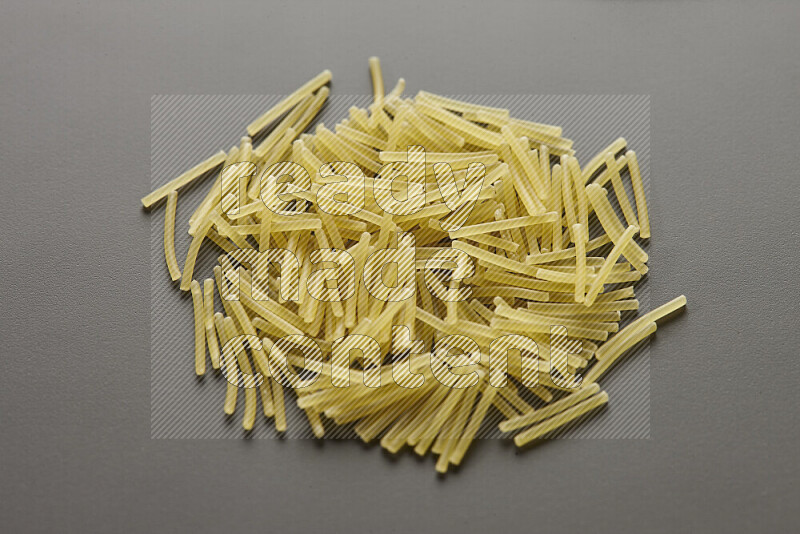 Vermicelli pasta on grey background