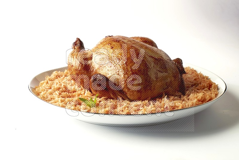 red basmati Rice with whole roasted chicken on a white plate with a silver rim direct on white background