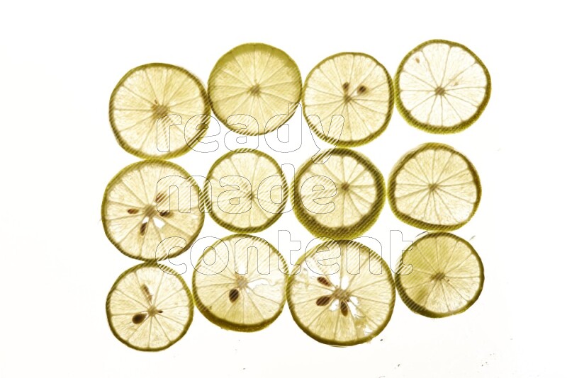 Lemon slices on illuminated white background