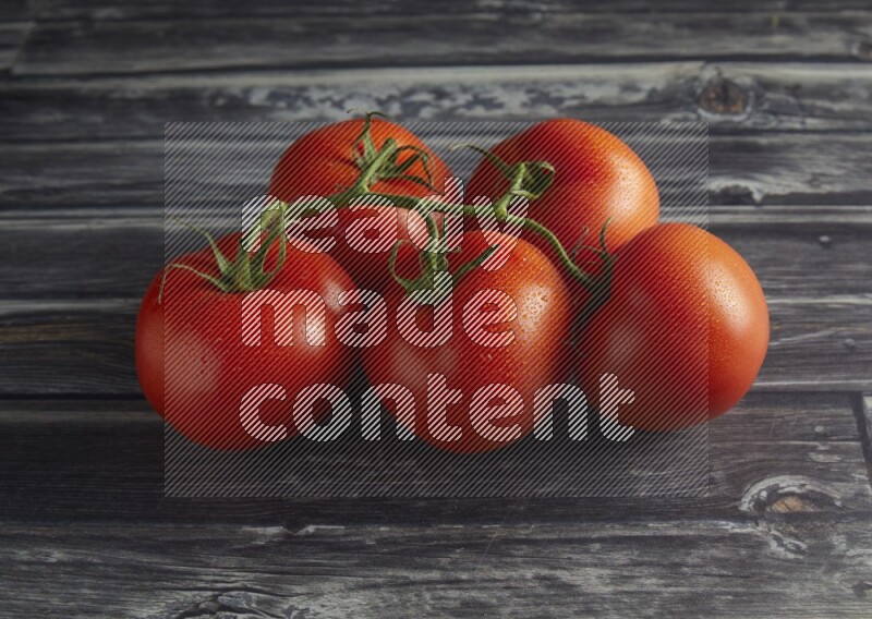 45 degree vein of roma tomato tomato on a textured grey wooden background