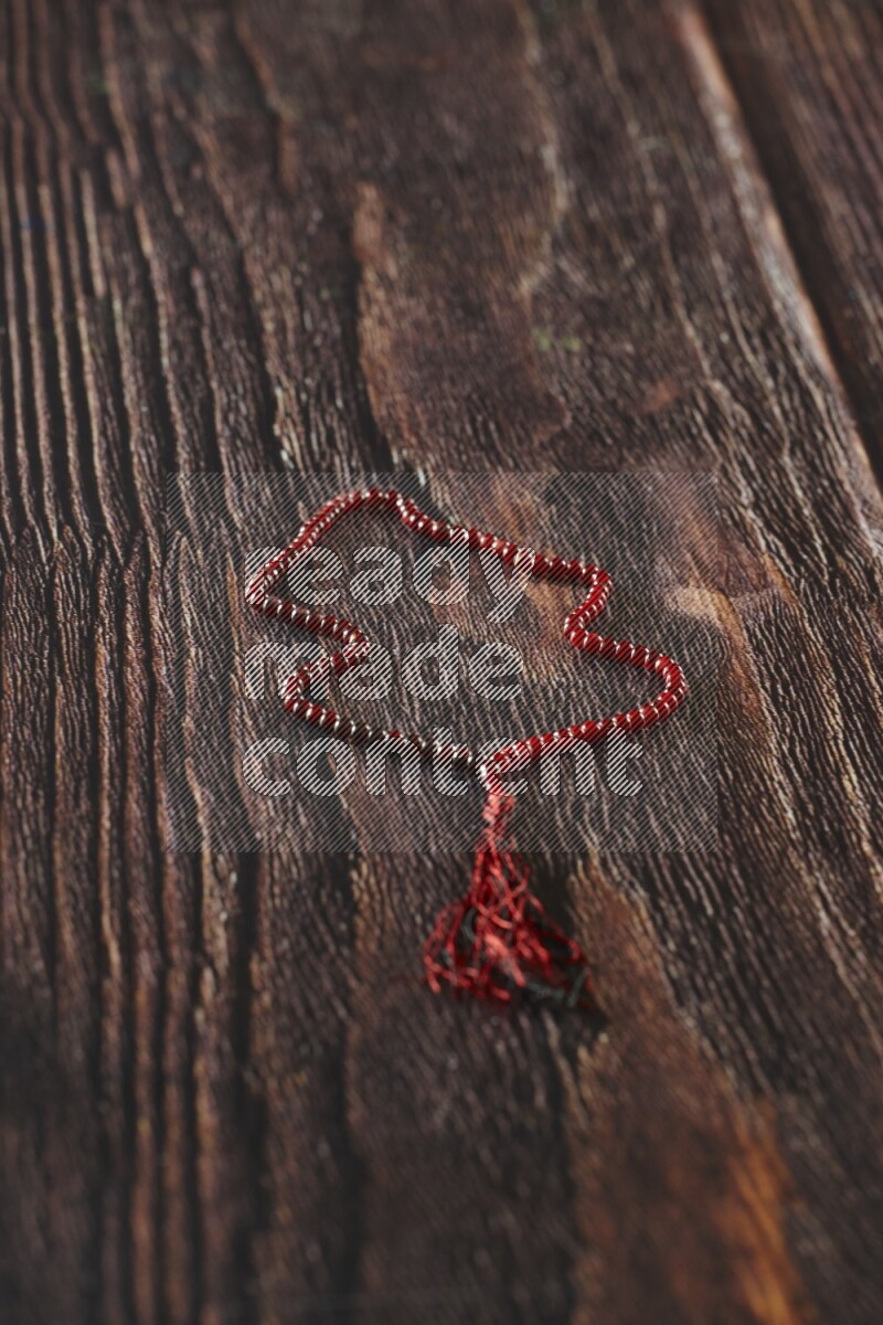 A prayer beads placed on wooden background