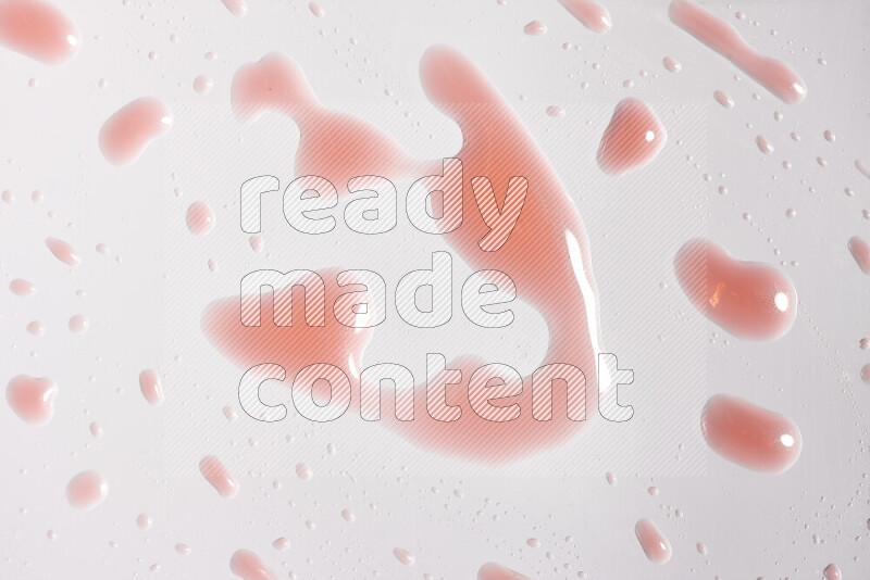 Close-ups of abstract red paint droplets on white background