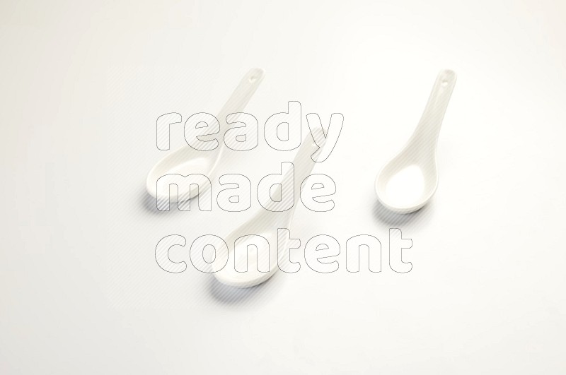 white ceramic soup spoon on white countertop