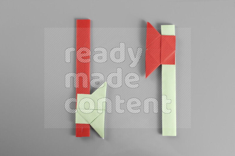 Origami axe on grey background