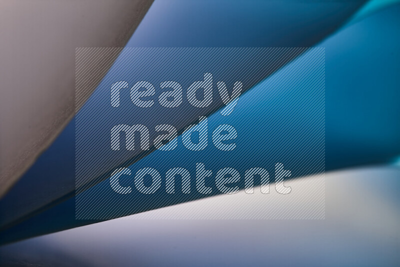 An abstract art piece displaying smooth curves in cold gradients created by colored light