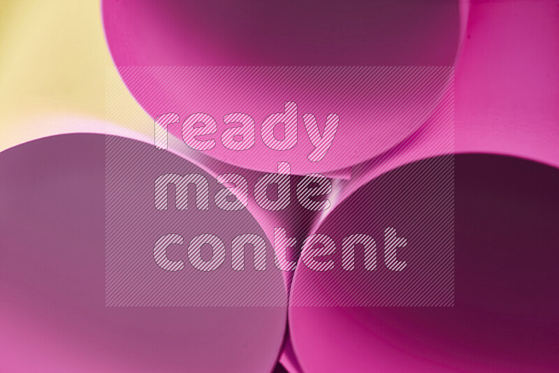 The image shows an abstract paper art with circular shapes in varying shades of pink and warm tones