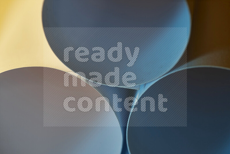 The image shows an abstract paper art with circular shapes in varying shades of blue and warm tones