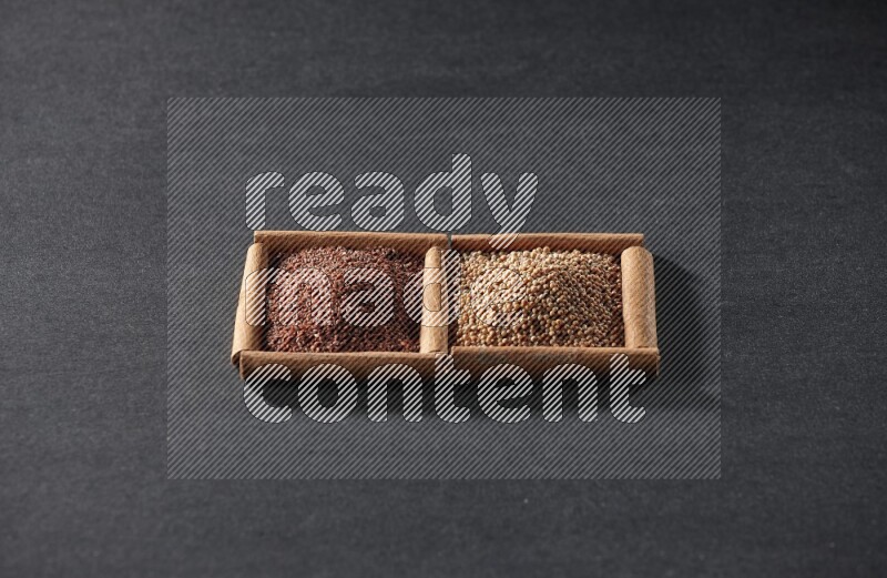 2 squares of cinnamon sticks full of mustard seeds and garden cress on black flooring