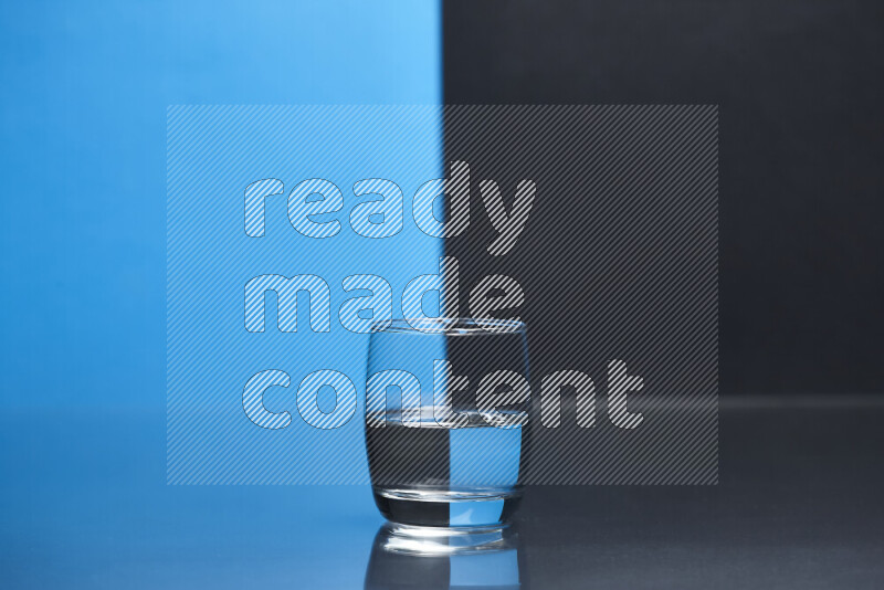 The image features a clear glassware filled with water, set against blue and black background