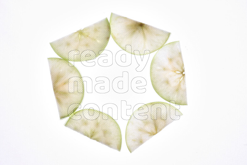 Apple slices on illuminated white background