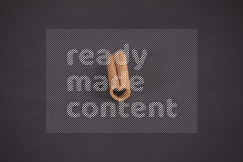 Cinnamon stick on black background