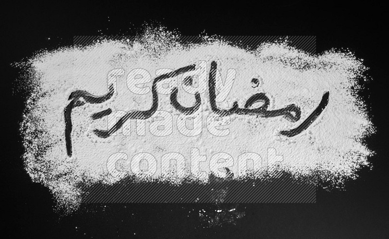 A sentence written with powder on black background