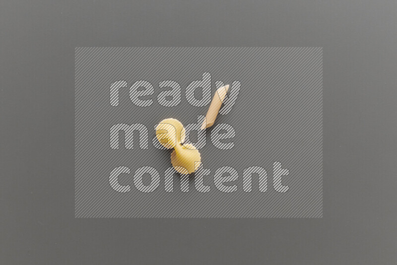 Fiocchi pasta with other types of pasta on grey background