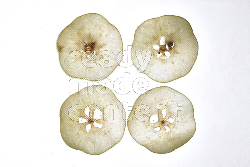 Pear slices on illuminated white background